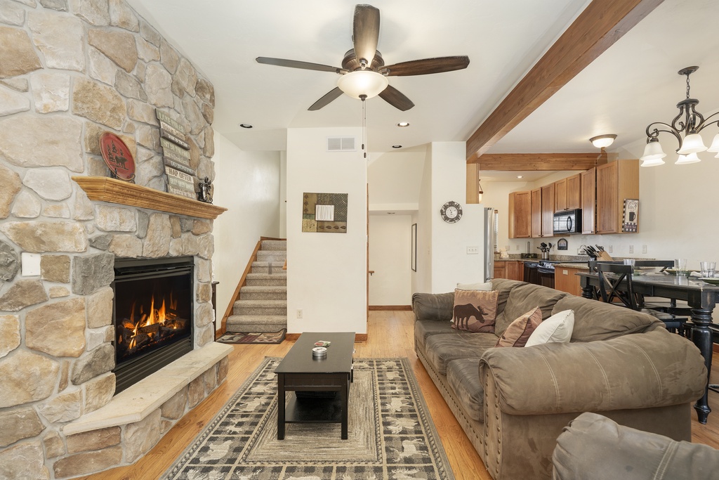 Cozy up by your crackling stone fireplace while planning meals in your fully-equipped kitchen—mountain comfort awaits.