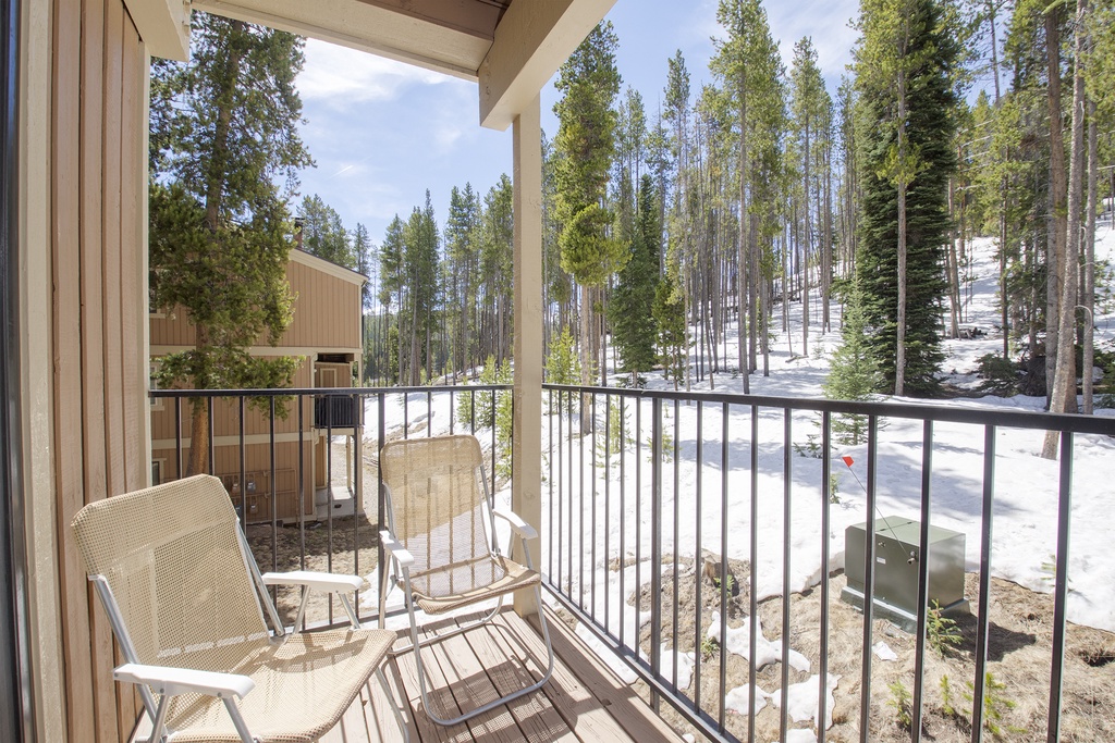Step onto your private balcony and breathe in fresh mountain air surrounded by towering evergreens and snow-dusted slopes.