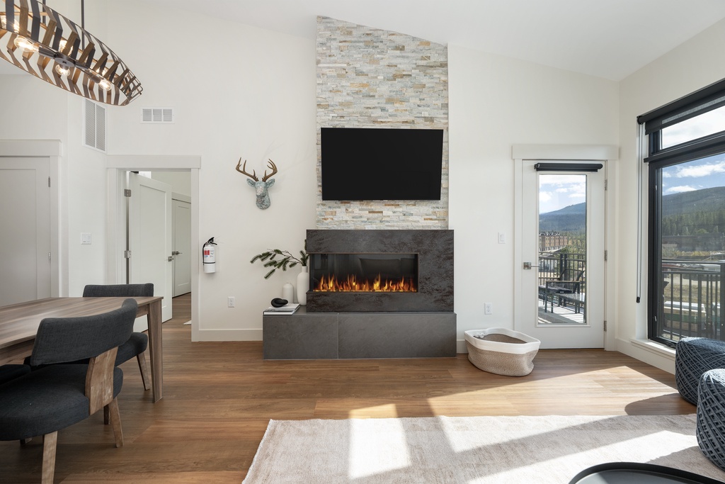 Unwind in this modern living space where your cozy fireplace and mountain views create the perfect retreat.