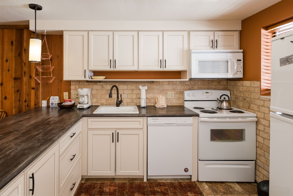 Your fully equipped kitchen features modern appliances, ample counter space, and everything you need to prepare meals during your stay.