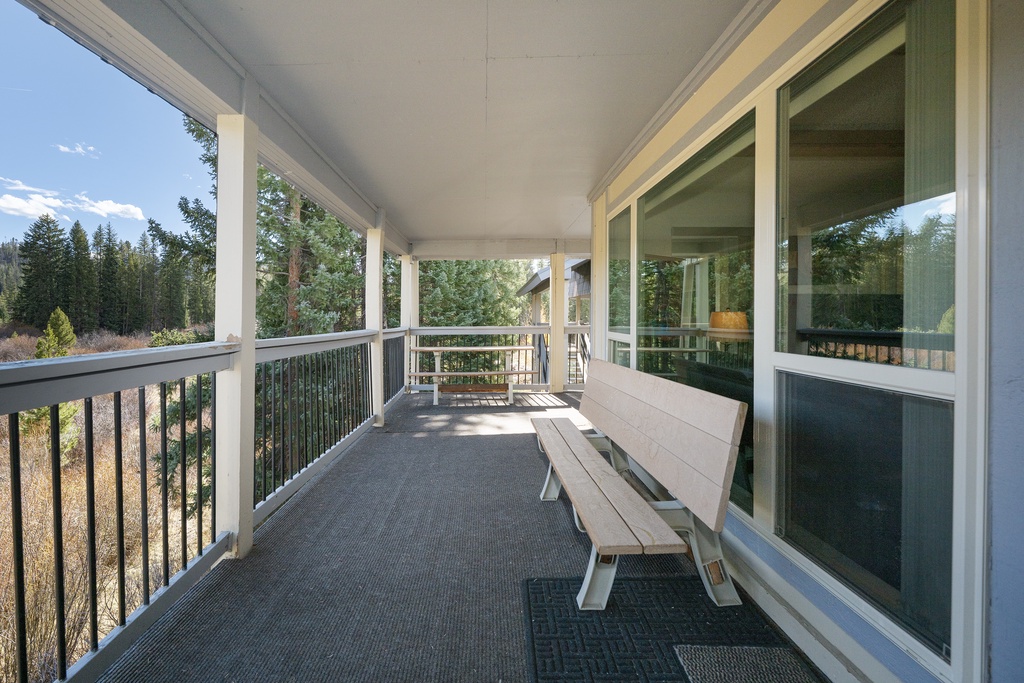 Step out onto your private covered balcony and breathe in the fresh mountain air while enjoying forest views from your comfortable outdoor seating.