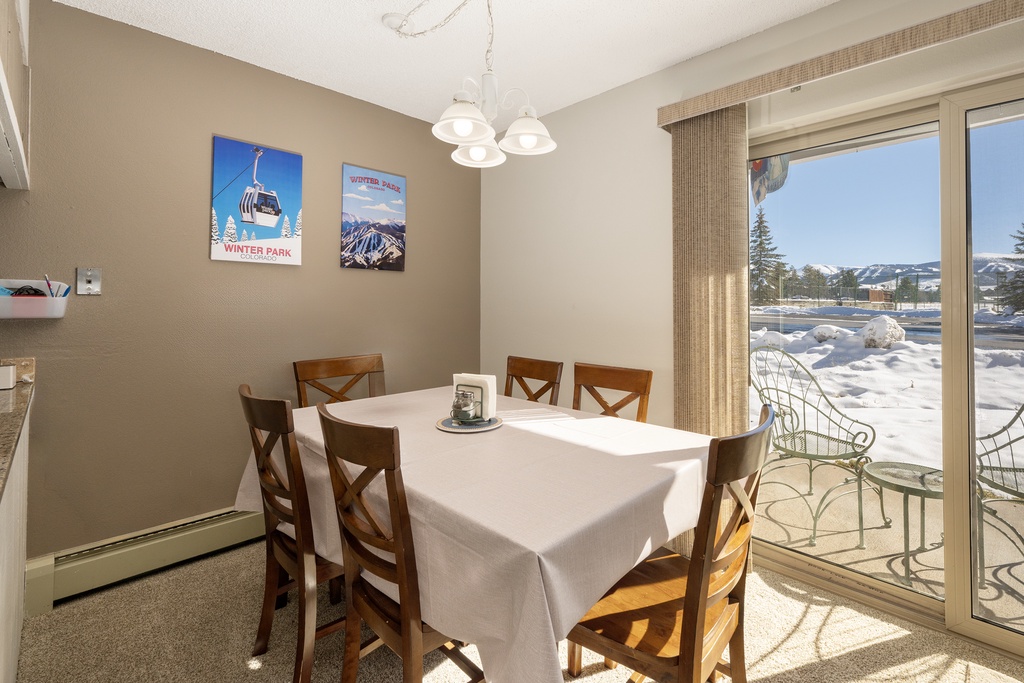 Gather around your dining table for hearty meals, with stunning snow-capped mountains visible through the window.