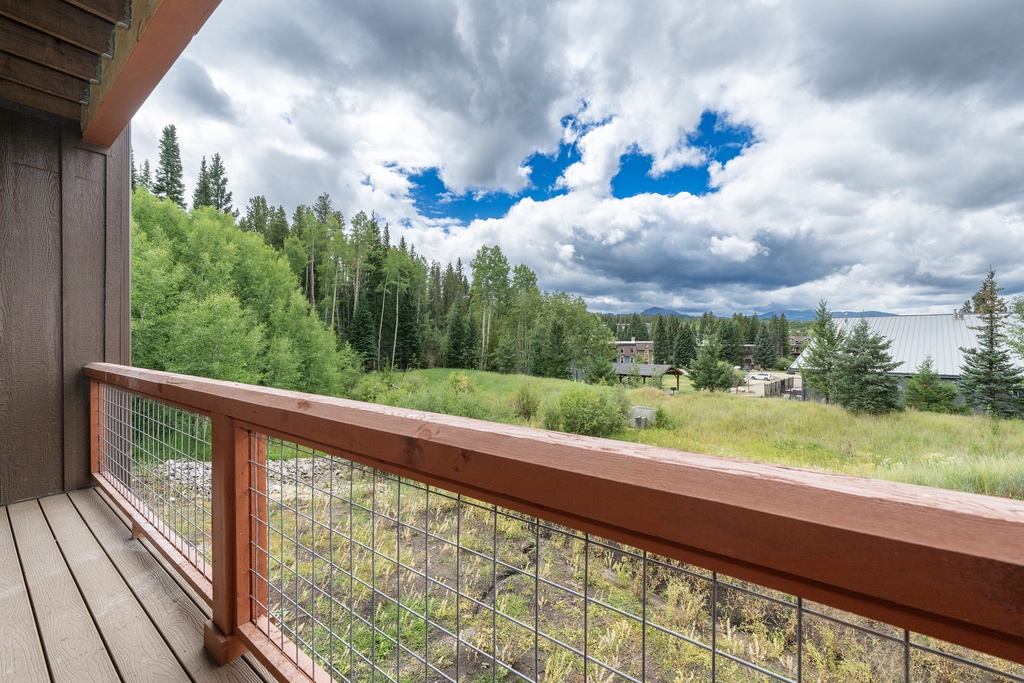 Step onto your private balcony and breathe in the fresh mountain air while enjoying expansive views of lush forests and meadows.