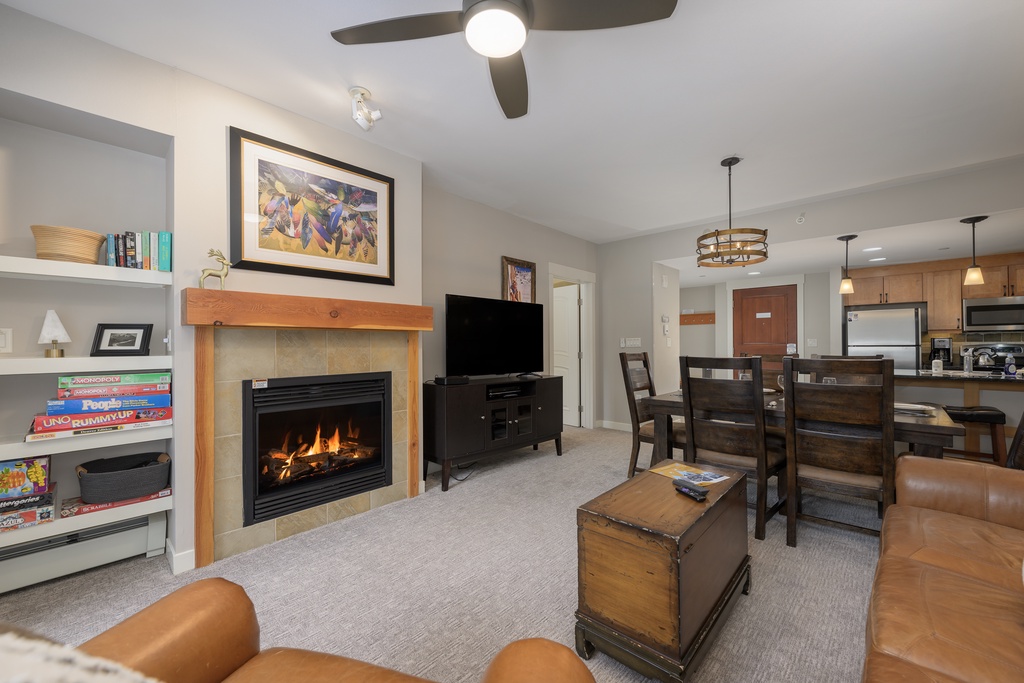 Cozy up by your crackling fireplace while enjoying modern comforts in this inviting living space with full kitchen.