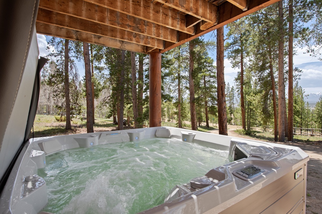 Soak under the stars in your private hot tub, where towering pines frame mountain views and the bubbling jets melt away every care.