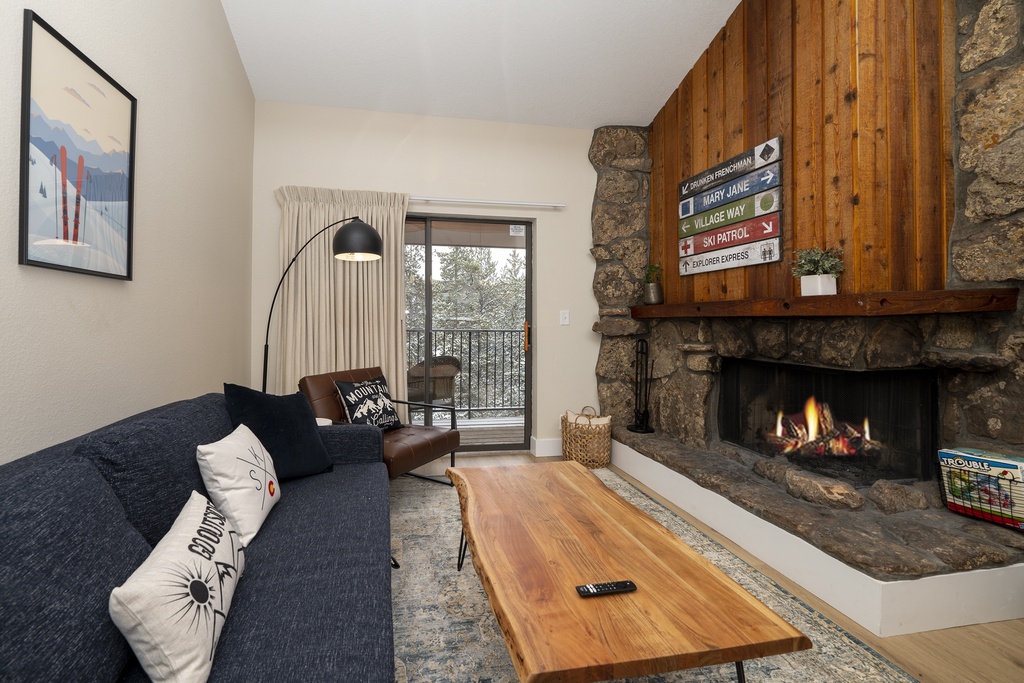 Cozy up by your crackling stone fireplace with mountain views from your private balcony - the perfect alpine retreat.