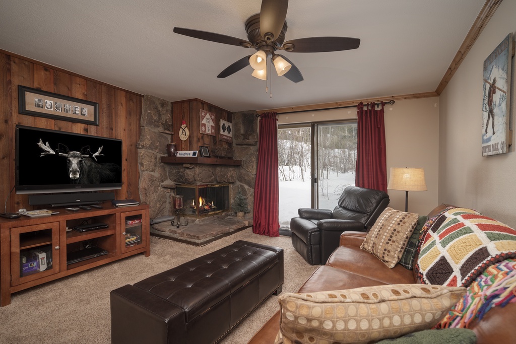 Cozy up by your stone fireplace while snow falls outside, creating the perfect mountain retreat atmosphere.
