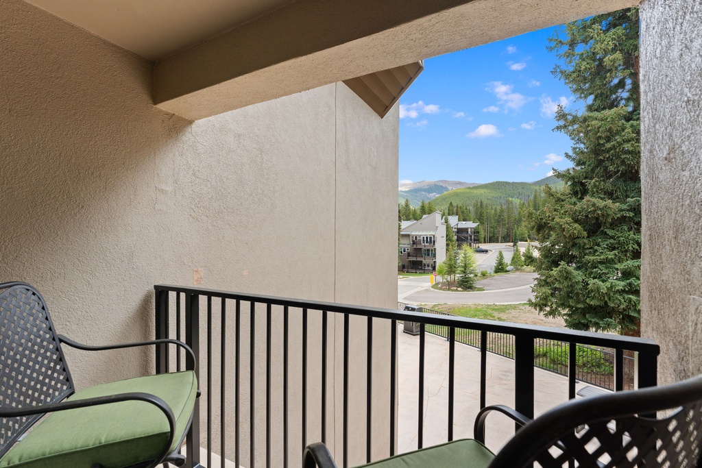 Step onto your private balcony and breathe in the crisp mountain air while soaking in stunning views of forested peaks and the peaceful neighborhood below.
