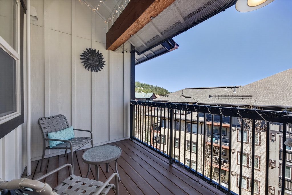 Relax on your private balcony with a good book and fresh mountain air. The cozy seating and decorative touches create the perfect spot for morning coffee or evening unwinding.