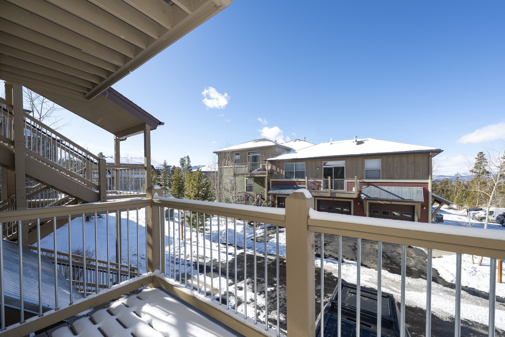 Mountain resort property surrounded by snow-covered landscape and clear winter skies.