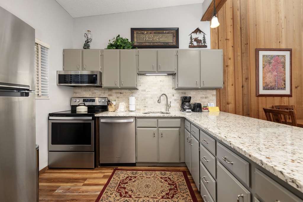 Your fully equipped kitchen features granite countertops, stainless steel appliances, and everything needed to create memorable meals during your stay.