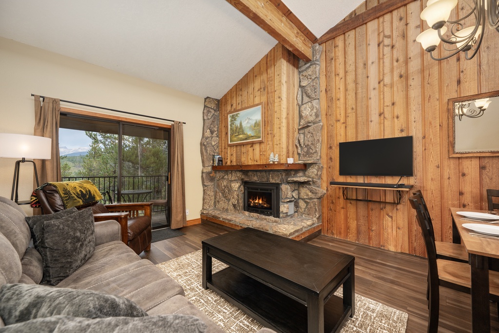 Cozy up by your crackling stone fireplace while enjoying mountain views through your private balcony doors.