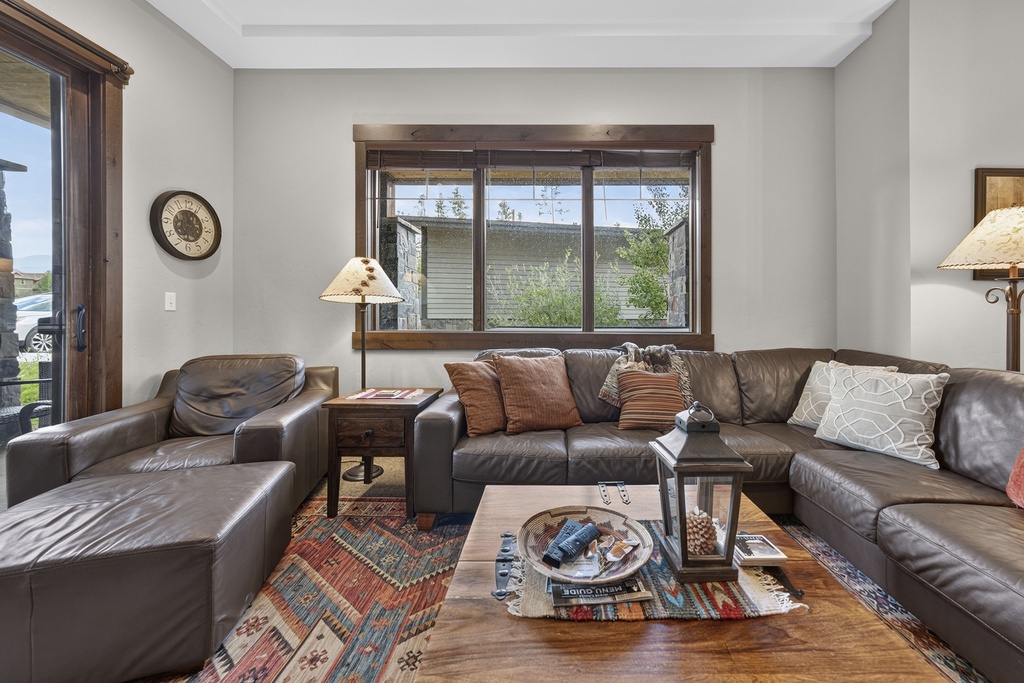Sink into buttery leather couches that invite you to relax and unwind in your inviting living room. Rustic wood accents and warm lighting create the perfect retreat after a day of exploring.