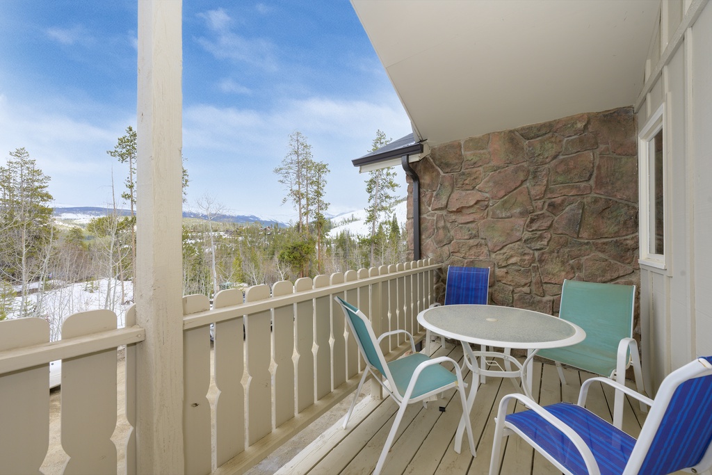 Sip your morning coffee on this peaceful balcony while taking in stunning mountain and forest views.