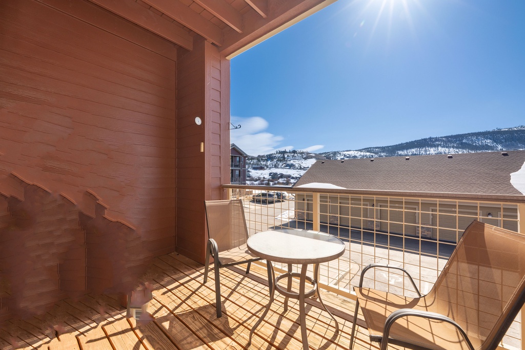 Step onto your private balcony and breathe in the crisp mountain air while taking in stunning views of rolling hills and distant peaks.