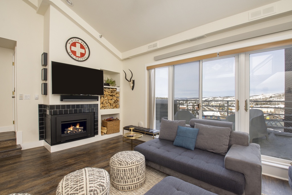 Stretch out on this spacious sectional sofa in your stylish living area, where exposed beams and Southwestern art create a warm, inviting atmosphere.