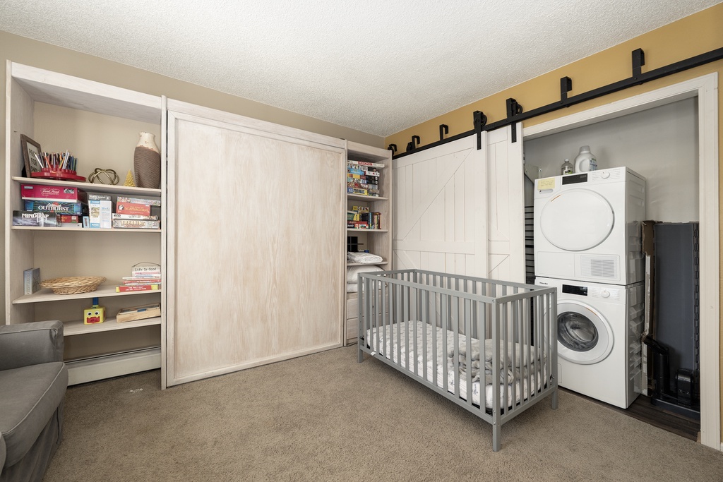 Your multi-functional space combines everything you need—storage, baby care, and convenient laundry access.