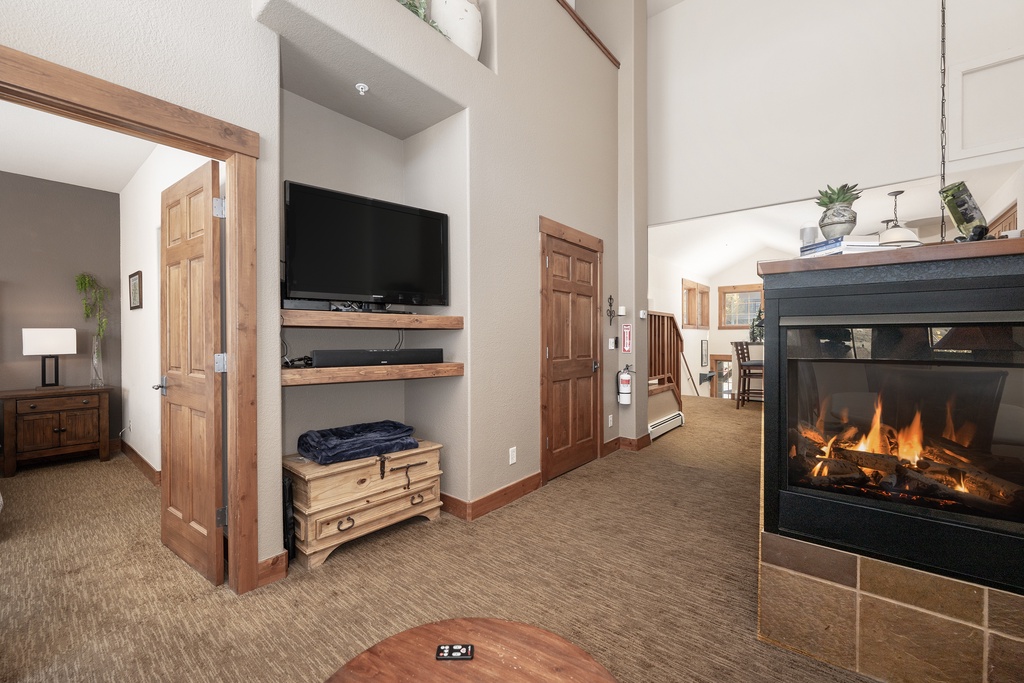 Cozy up in your spacious living area where warm flames dance in the fireplace while you watch TV on comfortable seating.