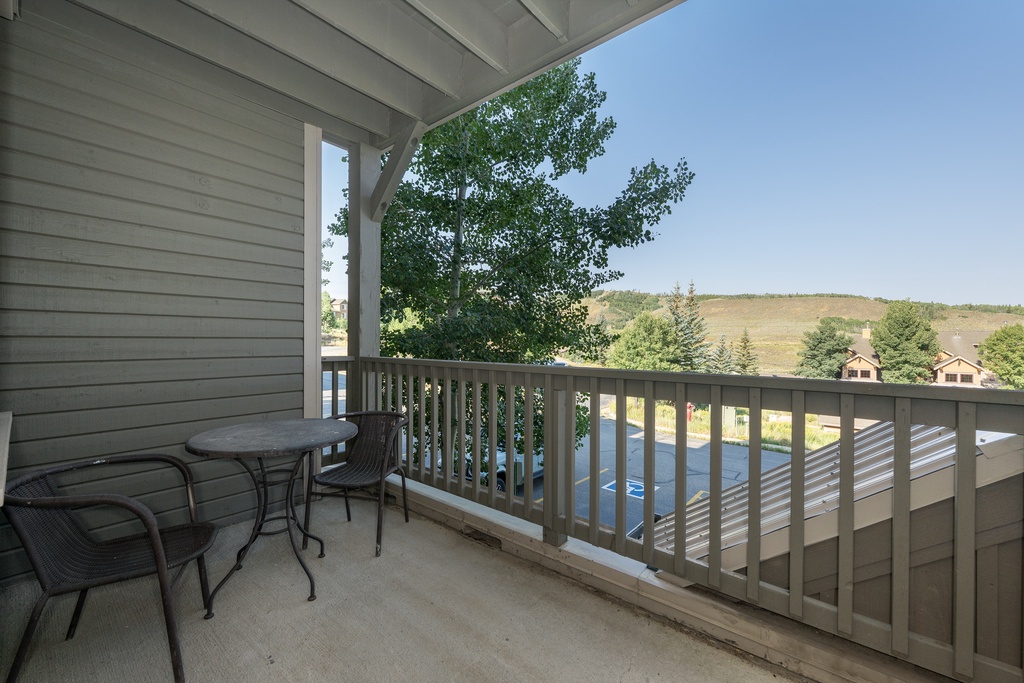 Step onto your private balcony at Kicking Horse Maverick 5-203 and breathe in the fresh mountain air while enjoying peaceful views of rolling hills and trees.