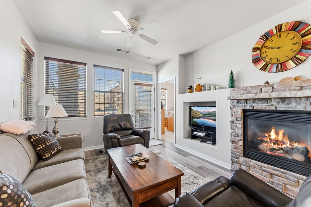 Unwind in your cozy living room with crackling fireplace and comfortable seating for perfect evenings.