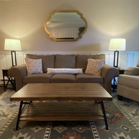 Step into your serene bedroom sanctuary with warm wood tones, elegant furnishings, and soft lighting that creates the perfect retreat.