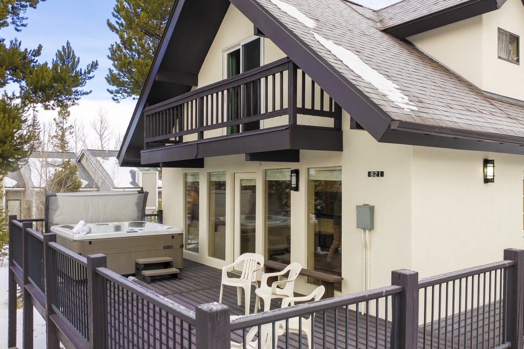 Soak in your private hot tub on the spacious deck, surrounded by snowy mountain views and cozy alpine charm.
