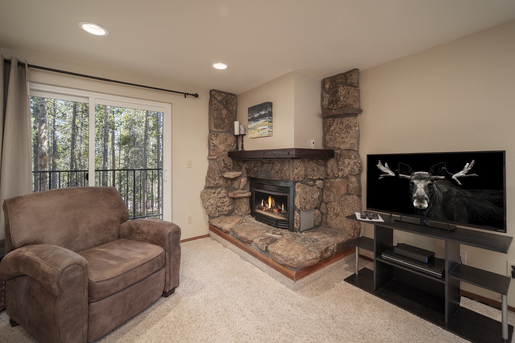 Sink into your favorite leather chair by the crackling stone fireplace while your favorite shows play on the large TV.