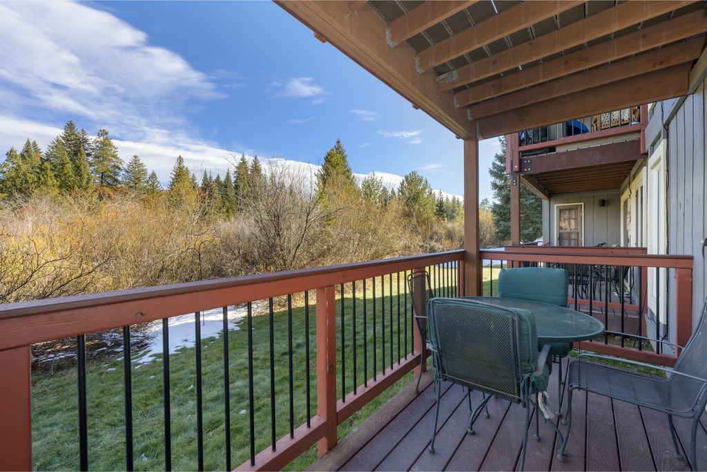 Enjoy your morning coffee on this peaceful balcony, surrounded by forest views and mountain vistas that stretch endlessly before you.