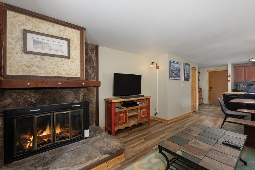 Cozy up by your crackling fireplace with mountain views and modern amenities at your fingertips.
