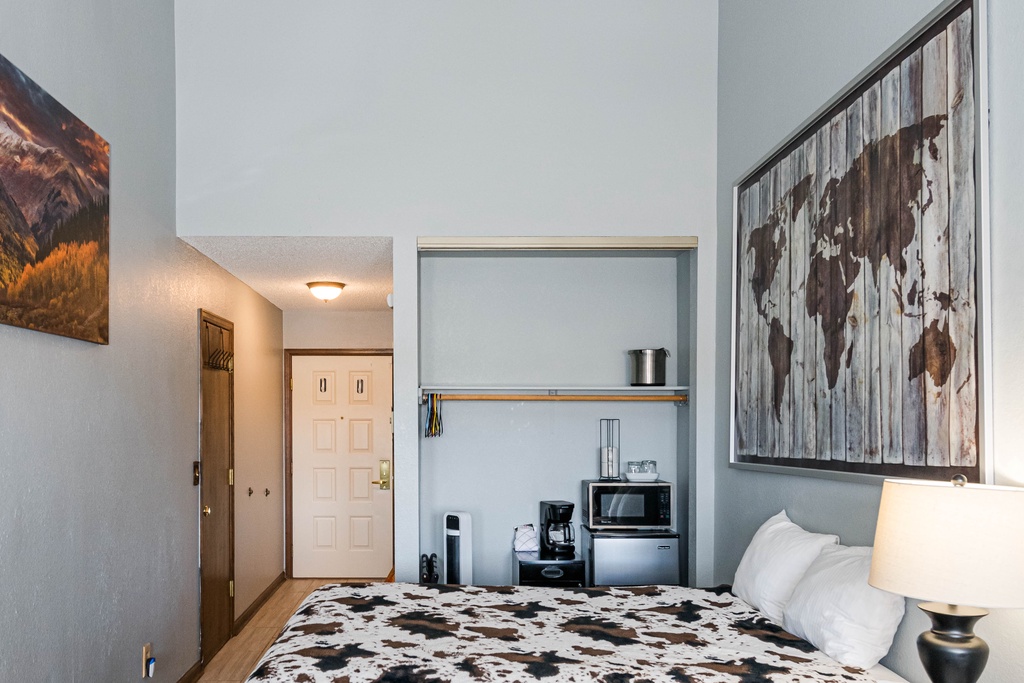 Settle into your cozy retreat with comfortable beds and convenient kitchenette featuring microwave and coffee maker for easy morning starts.