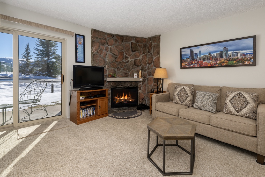 Cozy up in your living room with a crackling fireplace, mountain views, and all the comforts you need for perfect après-ski relaxation.