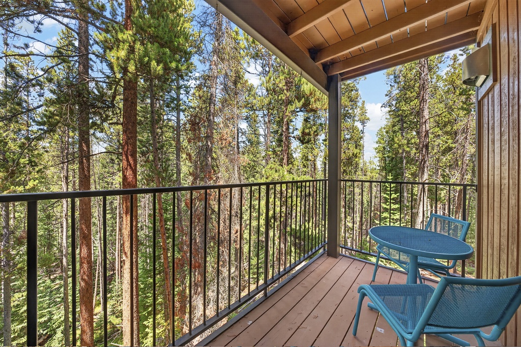 Step onto your private balcony and breathe in the fresh pine-scented air—towering evergreens surround you, creating a peaceful forest retreat where morning coffee feels magical.