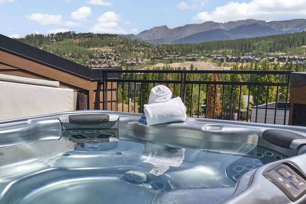 Soak in the warm bubbles of your private hot tub while gazing at stunning mountain peaks and forested valleys stretching endlessly before you—pure alpine bliss.