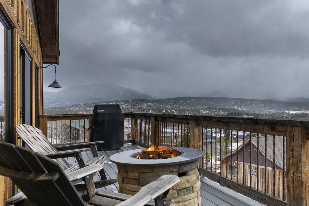 Cozy up by your private fire pit while savoring breathtaking mountain vistas from 224 GCR 4034 your wooden deck sanctuary.