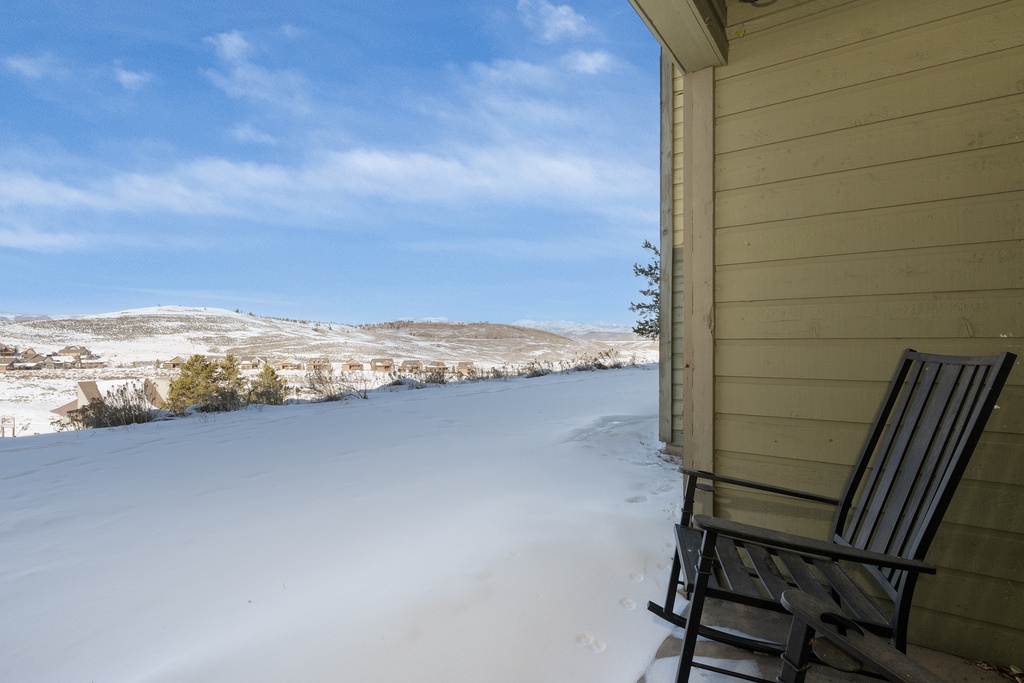 Step onto your private balcony and take in the breathtaking winter lake views stretching across snow-covered hills.
