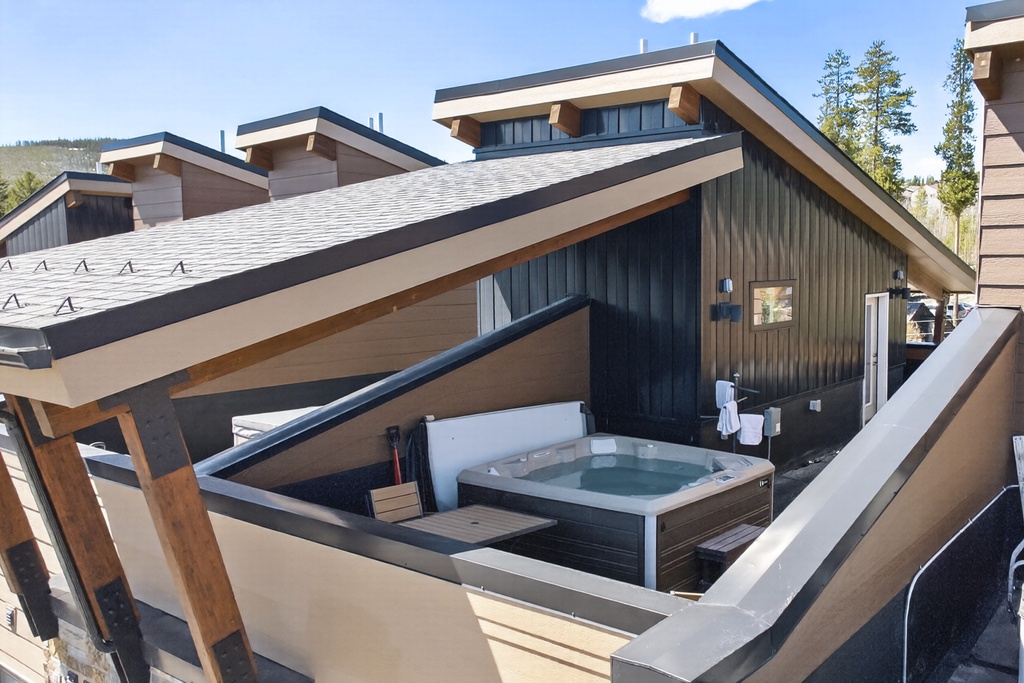 Your private rooftop hot tub awaits with mountain views and fresh alpine air for the perfect evening soak.