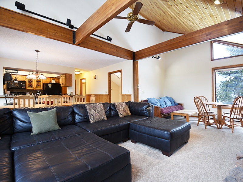 Stretch out on plush leather seating beneath soaring wood beams and cathedral ceilings in your spacious great room.