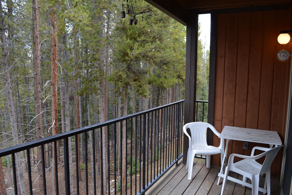 Step onto your private balcony and breathe in the fresh forest air while enjoying peaceful woodland views from your outdoor seating.