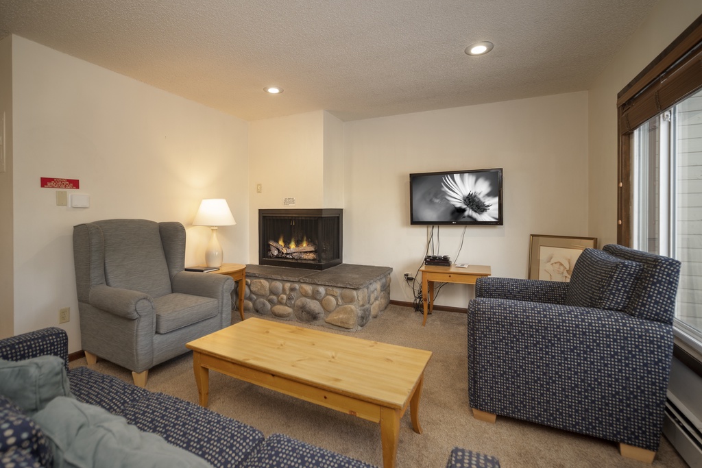 SWP Lions Gate Living room with fireplace and TV