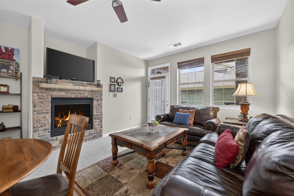 Sink into plush leather sofas as flames dance in the fireplace, creating your perfect spot to unwind after exploring the area.
