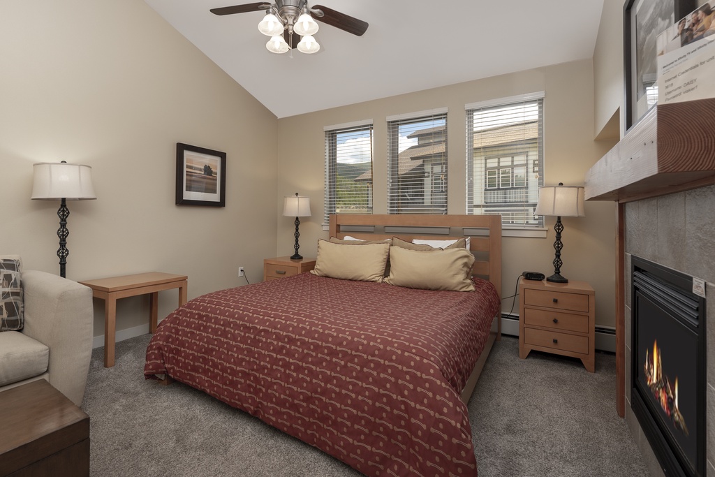 Drift off peacefully in your cozy bedroom, complete with a warm fireplace and mountain views through oversized windows.