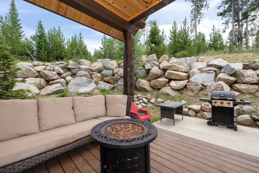 Unwind on your private deck with comfortable seating, a fire pit for cozy evenings, and BBQ for memorable meals.