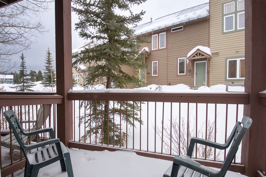 Step onto your private balcony for crisp winter air and peaceful mountain views, with cozy chairs perfect for morning coffee.