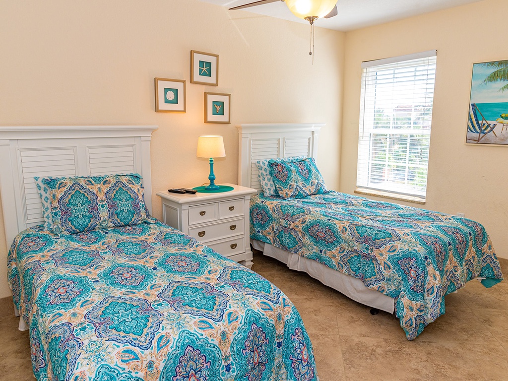 Spacious twin bedroom room for kids to play