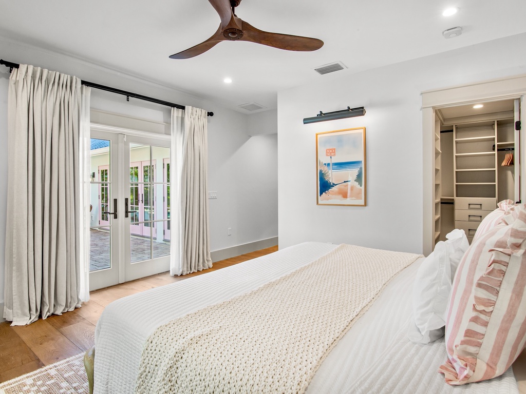 Primary bedroom with pool access and closet, King bed