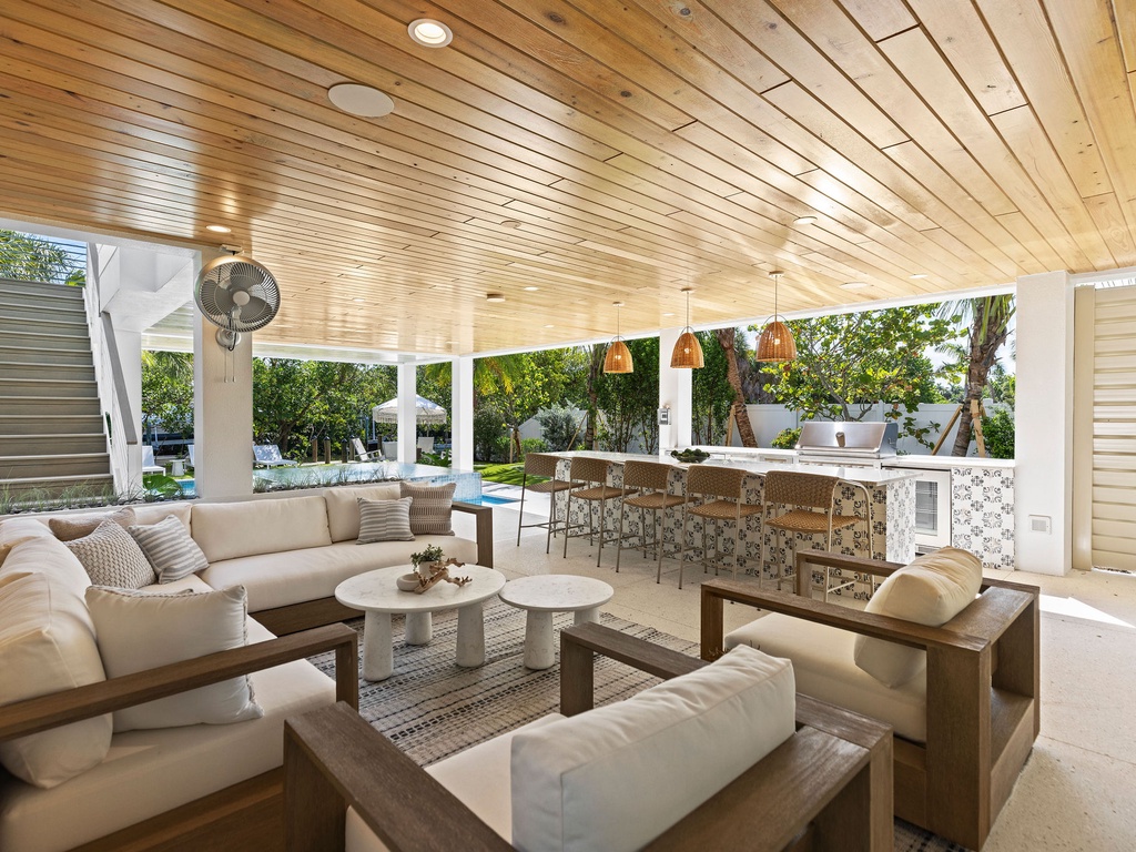 Outdoor Lounge with Kitchen and Island Seating