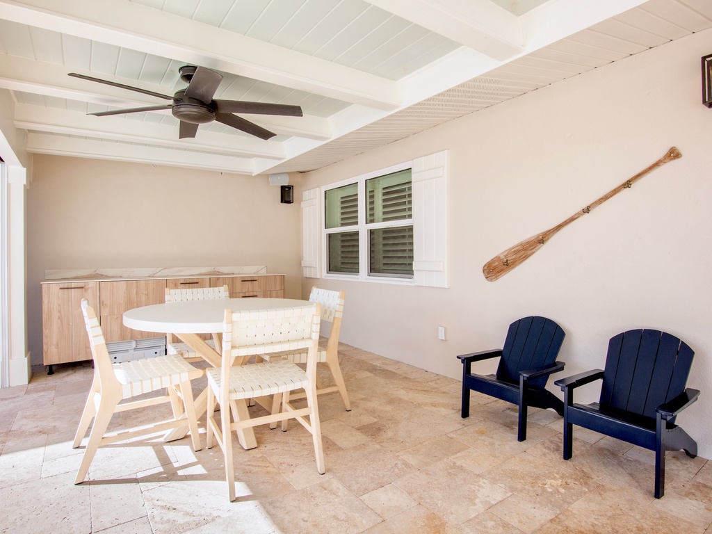 Private covered patio offers a dining area