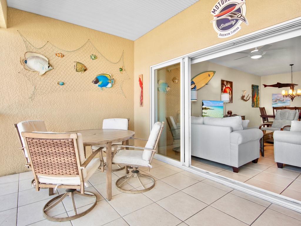 Screened-in balcony with dining table