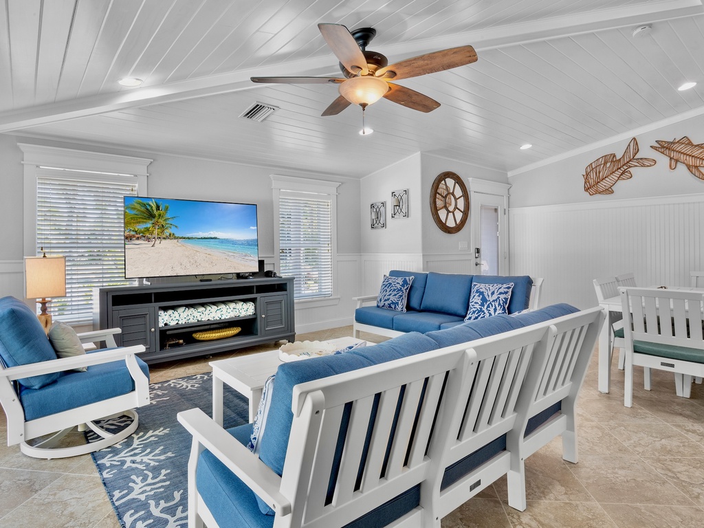 Living space with cozy blue seating and beachy decor
