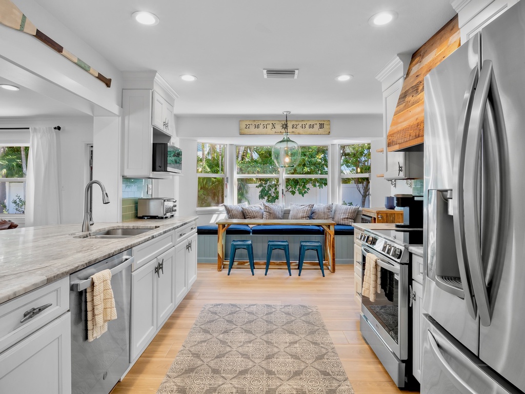 Fully equipped kitchen with bright breakfast nook